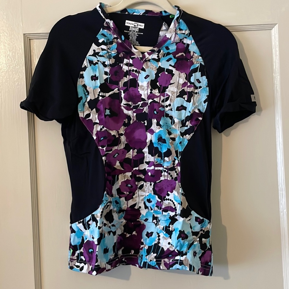 Scrub top. Never worn. Has stretch for comfort. Perfect for healthcare worker.